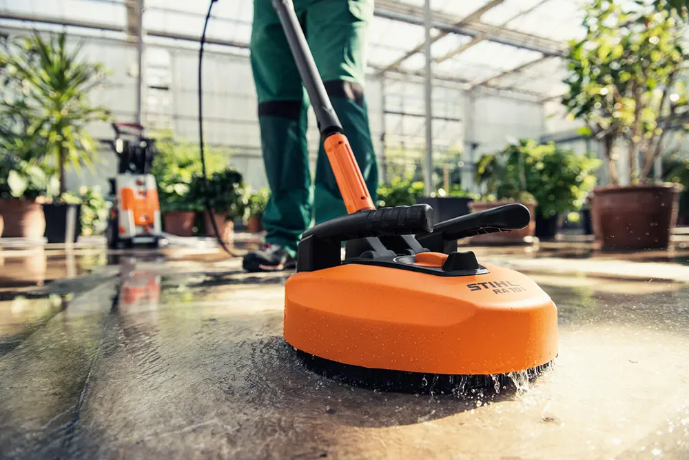 Washing the patio with a Stihl pressure washer